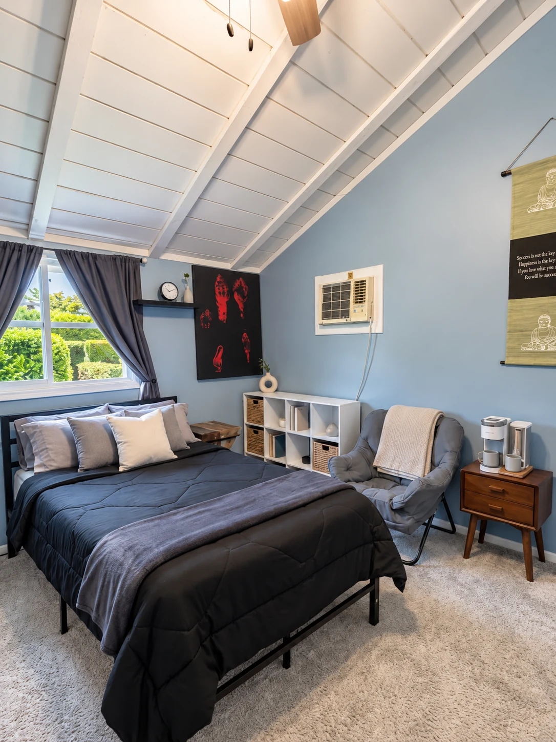 Citronia Recovery bedroom with a bed, chair, storage, and natural light from the window