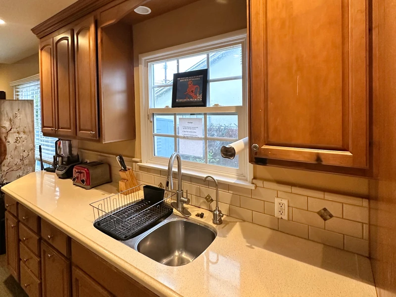 The sink, window, cabinets and preparation counter in Citronia Recovery’s shared kitchen